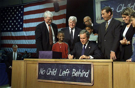 Signing into law No Child Left Behind.