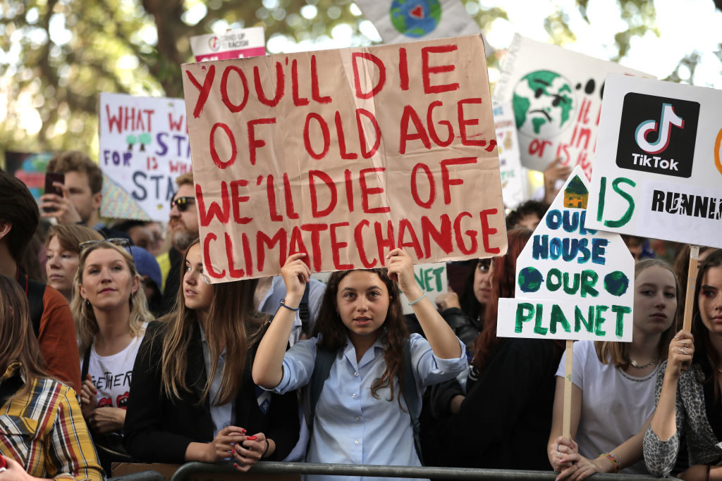 sign: you'll die of old age; we'll die of climate change