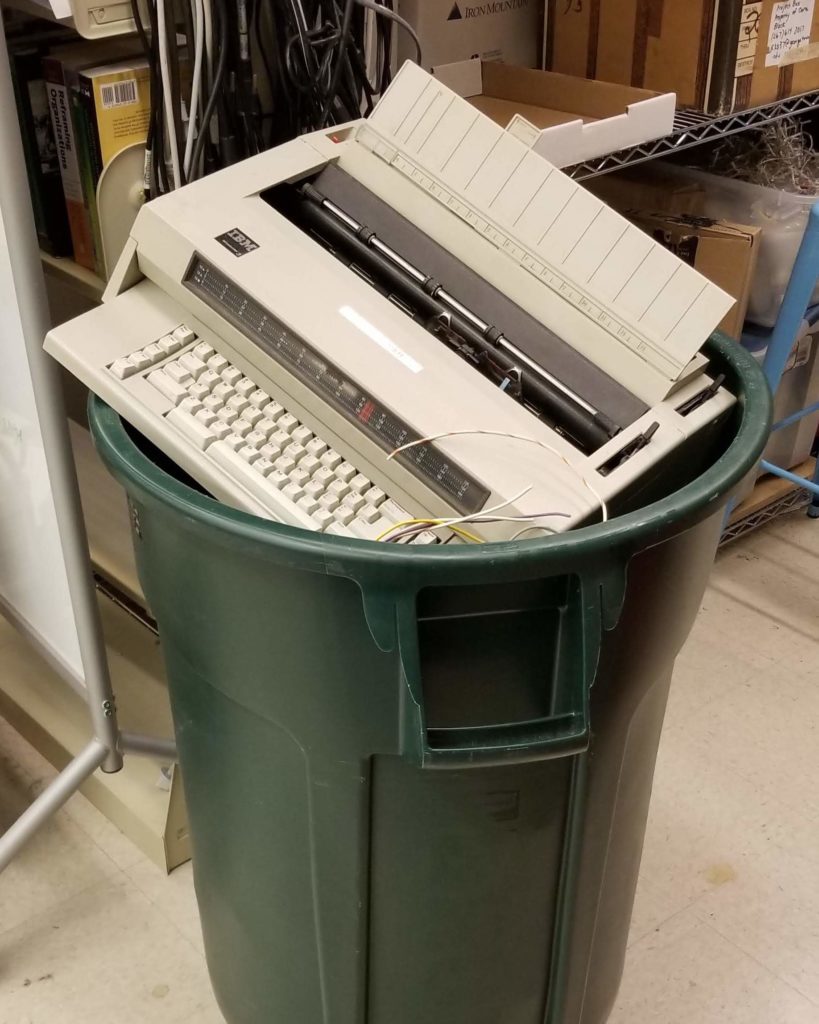 typewriter in the trash