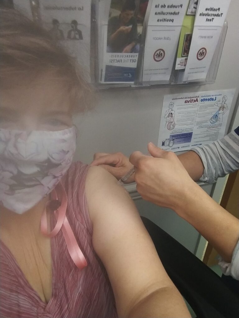 Ceredwyn getting COVID shot Moderna vax Laura