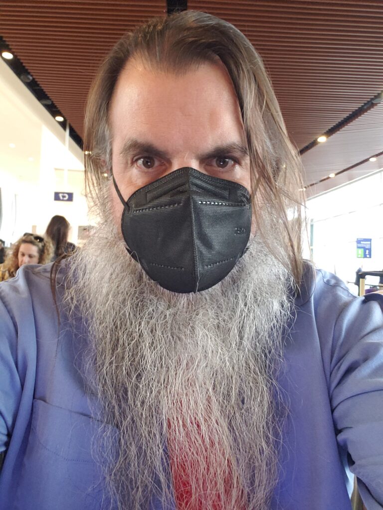 Bryan Alexander masked at New Orleans airport 2023 February 10