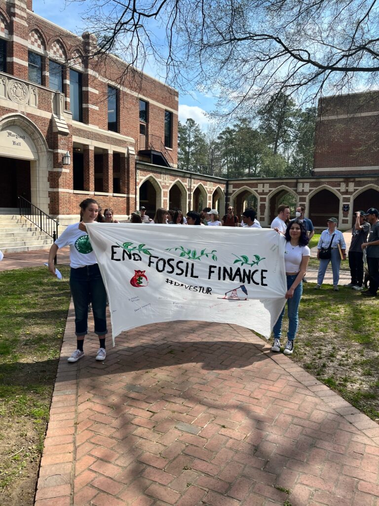 University of Richmond students march with banner reading end-fossil-finance_Chronicle 2023 June