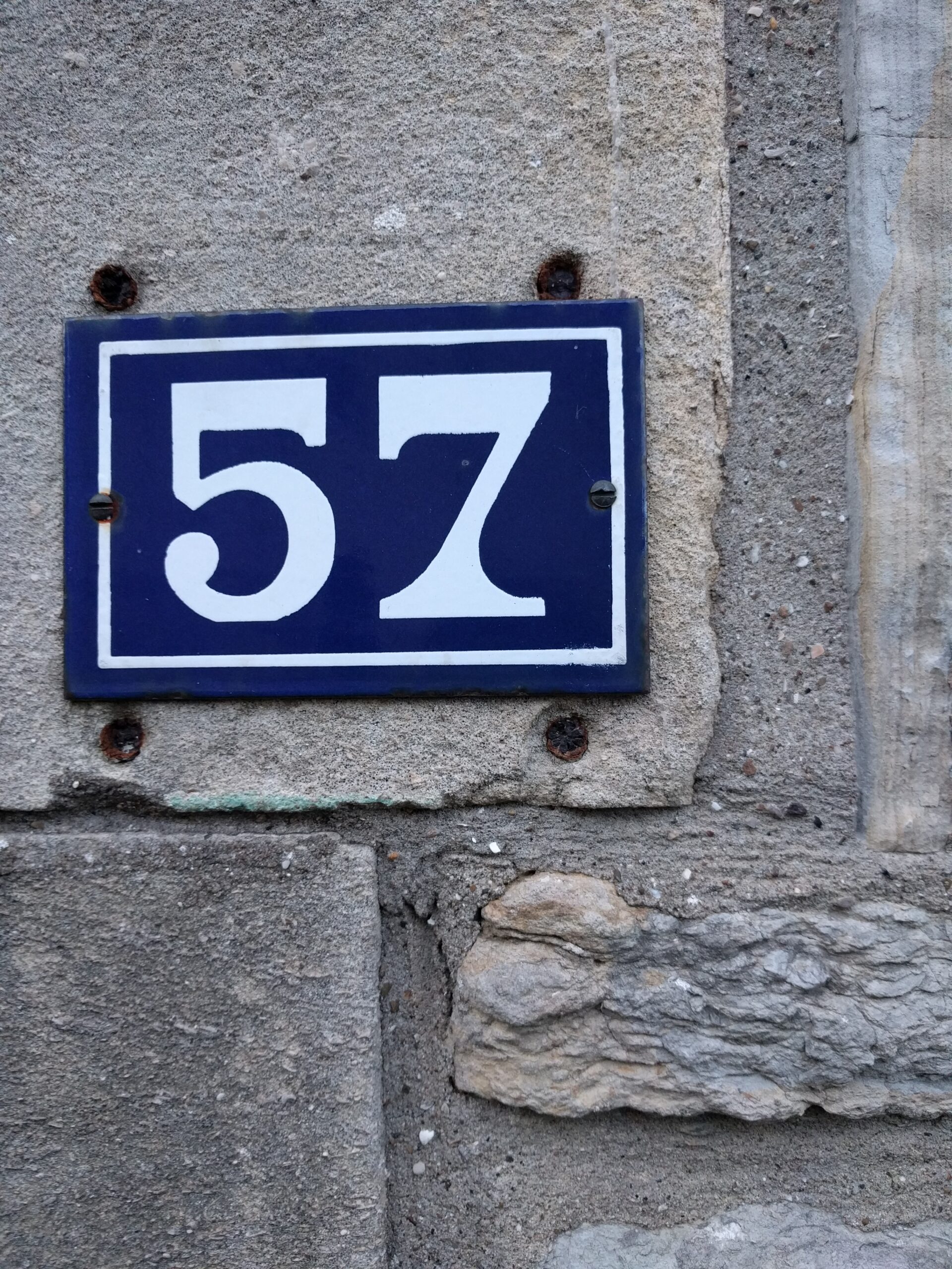the number 57 on a street corner